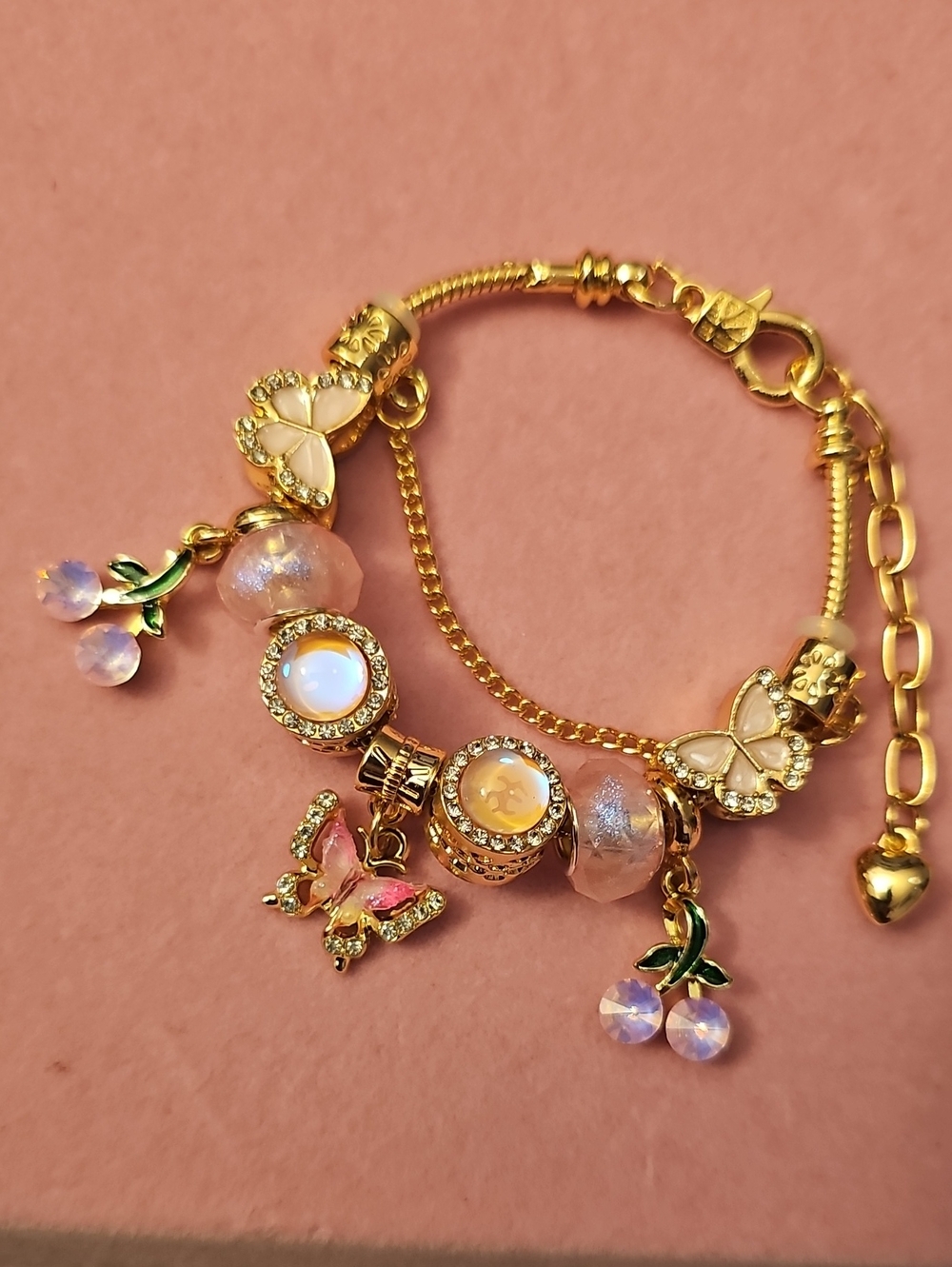 Gold-Plated Pink Charm Bracelet with Opalescent Accents